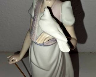 This is Lladró “Picture Perfect” #7612 — girl with parasol/umbrella, dove, and dog. It was a 1991 Lladró Society piece, sculpted by Juan Huerta, about 8.75" tall.