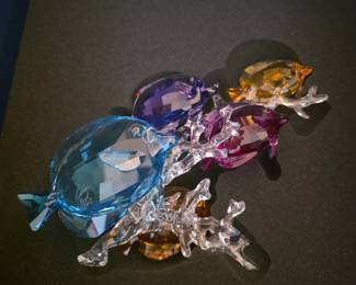 This is a Swarovski Paradise Rainbow Fish Family figurine (article #5223195), featuring five multicolored fish on a clear crystal coral base.