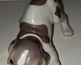 Lladró “Gentle Surprise” #6210, a brown-and-white puppy with a little butterfly on its tail.