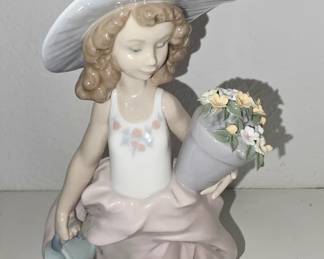 Lladró porcelain girl with watering can and flowers, likely “Spring Girl / Spring is Here”