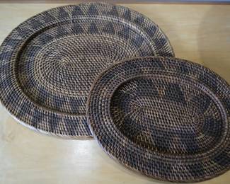 These vintage-style wicker rattan oval decorative bowls feature a distinct dark brown woven pattern.