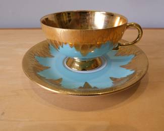 This is a vintage RKW Bavaria China set featuring a teacup and saucer with a teal blue and gold design.Manufacturer: Rudolf Wachter (RW Bavaria), Made in Germany.Design: Turquoise/Teal blue porcelain with ornate gold trim.