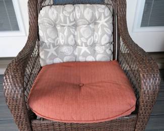 This high-back resin wicker rocking chair features a dark brown weave and comes with contrasting cushions. Note that it's missing a screw.