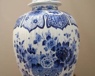 This is a Royal Delft Blue and White Hand-Painted Jar with a Foo Dog finial on the lid. Note some condition issues with rim and lid.