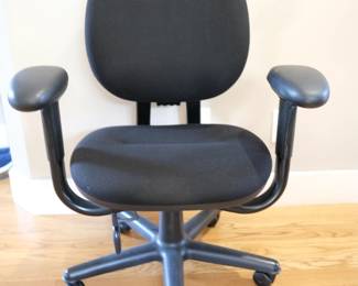 Steelcase Criterion chair, featuring black fabric upholstery and adjustable arms.