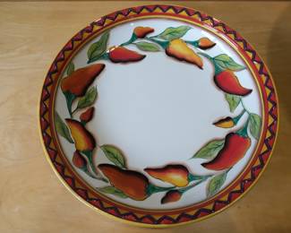 This is a Clay Art Santiago serving platter featuring a hand-painted red and yellow chili pepper design.Brand: Clay Art.Pattern: Santiago.Material: StoneLite ceramic.Size: Approximately 16 inches.