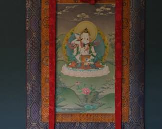 This thangka depicts Vajrasattva in union with his consort Vajratopa (also known as Dorje Sempa and Nyemma) in the Karma Gadri style. The Deity Union (Yab-Yum): The central figures represent the tantric union of compassion/skillful means (Vajrasattva) and primordial wisdom (Vajratopa). Vajrasattva holds a vajra in his right hand at his heart and a ghanta (bell) in his left hand at his hip. Karma Gadri Style: The artwork beautifully demonstrates the hallmarks of the Eastern Tibetan Karma Gadri tradition. This includes a highly spacious composition, delicate translucent halos, fine linework, and an ethereal, open landscape background heavily influenced by Chinese painting aesthetics.