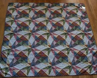 A 92" x 91" size classification fits perfectly as a Queen-size quilt (standard queen dimensions typically run around 90" x 90" to 92" x 108"). Knowing it is completely hand-stitched significantly elevates its value, craftsmanship, and care instructions compared to machine-made versions. eBay or secondary market forums, prices fluctuate heavily based on condition. Excellent-condition vintage hand-quilted items generally fetch $150 to $400 depending on the buyer's appreciation for the specific "scrappy" pattern.