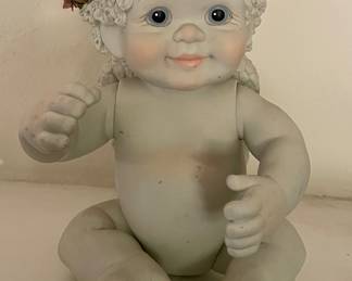 PORCELAIN JOINTED CHERUB FIGURE