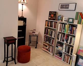 GREAT SELECTION OF BOOKS, STORAGE OTTOMAN, TALL TABLE , CDS.