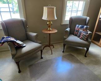 Wingback chairs  and glass door cabinet