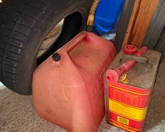 Vintage Metal Oil Can and Red Plastic Gasoline Can