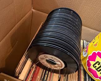 Collection of Vintage 45 RPM Vinyl Records with Metal Record Caddy