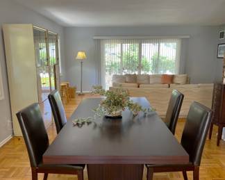Here we have a dining room table, with four matching chairs.