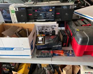 For instance, this photo shows a boom box (AM/FM receiver, cassette player with 5-band EQ), a pet nail trimmer, and a mystery tool box.