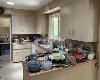This overview picture of the kitchen also shows the clock above the sink.  