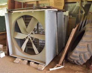 Industrial Poultry House Exhaust Fan and Large Agricultural Tractor Tire