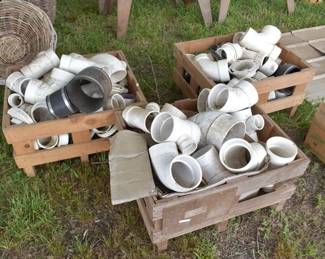 Assorted PVC Plumbing Couplings and Fittings in Vintage Wooden Crates