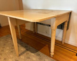 This is a vintage drop-leaf farmhouse table, painted. Surface needs love but the table is in terrific condition. Approximate scale opened is 6' x 4'.