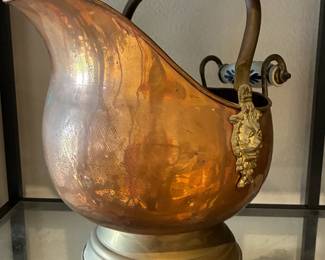 Antique copper pitcher with delft ceramic handles.