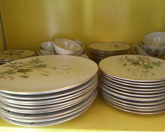 Lot 37: Floral porcelain dinnerware with teacups