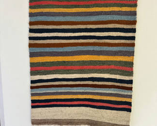 Lot 78: Striped woven rug with fringe