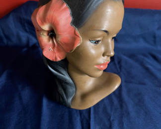 Lot 69: Hibiscus-ornamented female bust sculpture