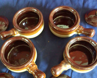 Lot 19: Four ceramic pots with lids