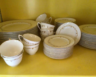 Lot 36: White porcelain dinnerware set with gold trim