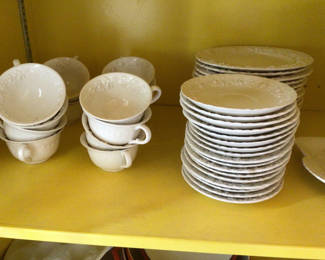 Lot 35: White ceramic teacups with saucers and plates