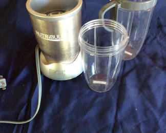 Lot 17: NutriBullet blender with cups and lids