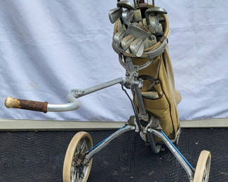Lot 96: Vintage Rolling Golf Bag + Clubs