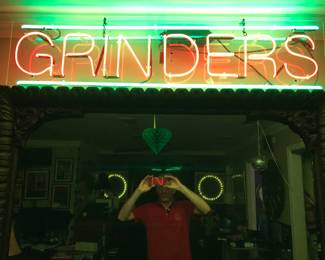 NEON GRINDERS SIGN