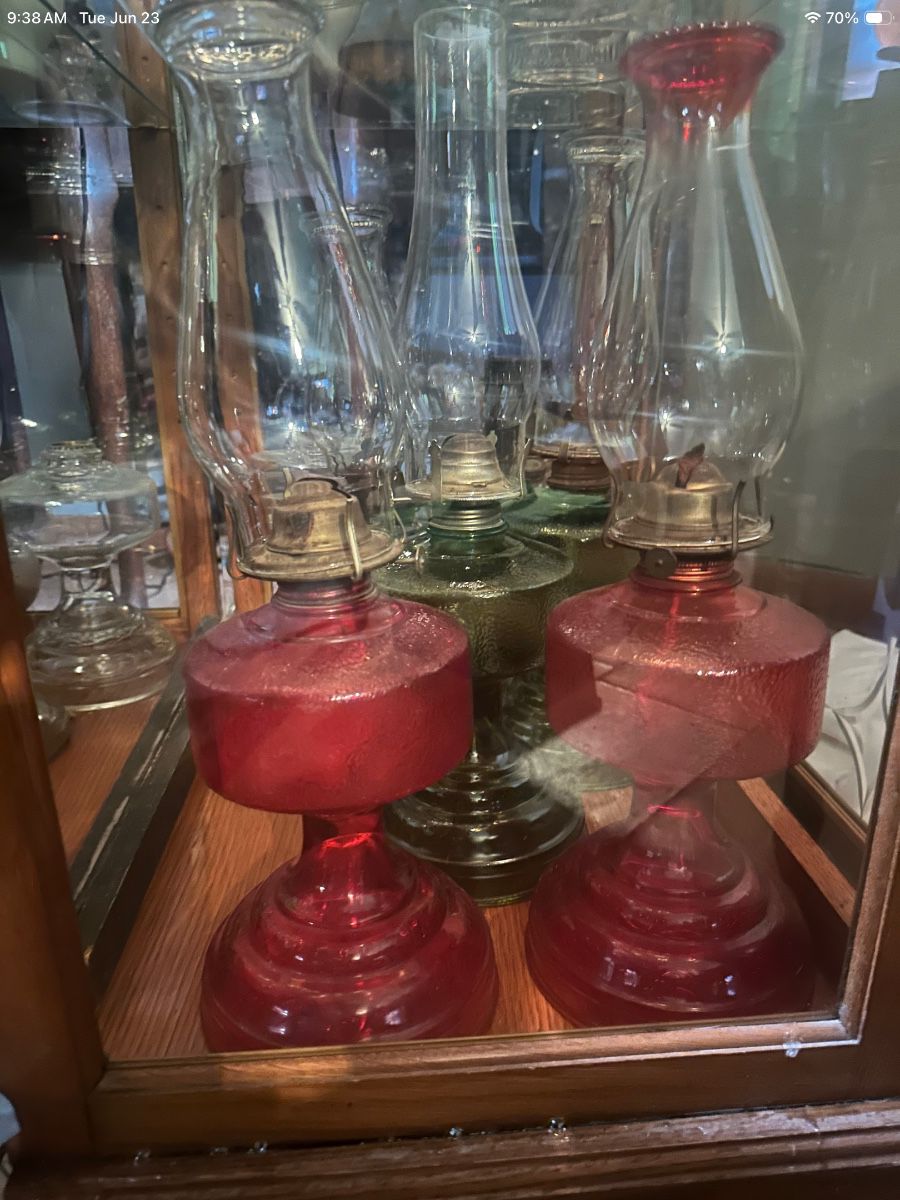 Large collection of oil lamps