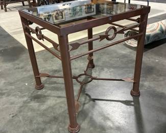 Iron side table with glass top and arrows