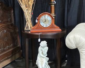 Woman sculpture, mantle clock, round end table