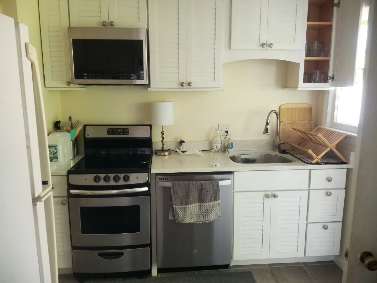 Small kitchen with stainless steel appliances