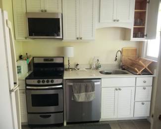 Small kitchen with stainless steel appliances