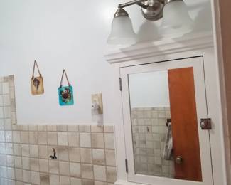 Mirrored medicine cabinet; vanity lights