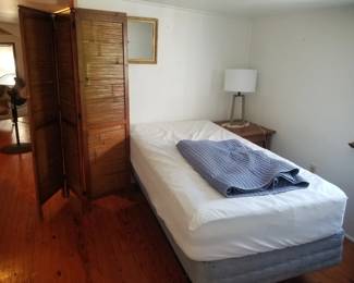 Twin bed; folding screen; end table; table lamp