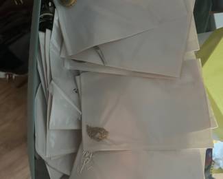 There will be some better jewelry in these envelopes, also sterling silver spoons.