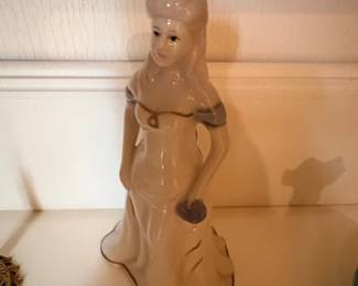 Porcelain Figurine of a Woman in a Gown