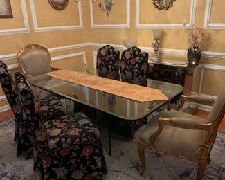 Glass Dining Table with Ornate Traditional Chairs and Floral Upholstered Chairs