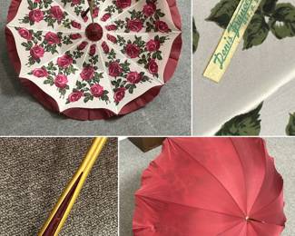 A vintage French red parasol/umbrella with pagoda-shaped ruffled-edge canopy with colorful red roses on white fabric interior, made by Denis Francet, Paris