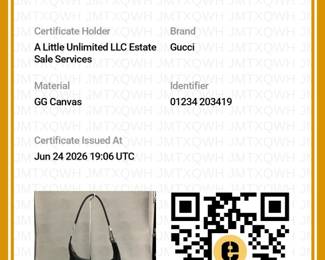 Certificate of Authenticity from Entrupy for the Gucci GG canvas hobo bag featuring black monogram canvas and silver-tone hardware; authenticated by Entrupy.