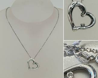JCM sterling silver and diamond heart pendant necklace, in open heart design accented with a small diamond; made in Italy