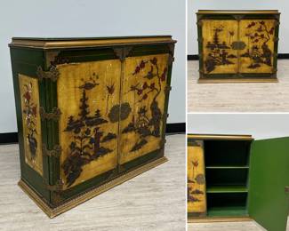 A Chinoiserie style cabinet with double doors, decorated with carved relief and painted landscape and floral scenes, interior with shelf area; 37”W x 17”D x 34”H.