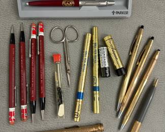 Vintage and classic writing instruments including a Parker Jotter ballpoint pen in Kensington Red with chrome trim and University of Denver emblem, in original case; several Autopoint mechanical pencils featuring advertising for Sloan flush valves; Cross Classic Century ballpoint pen and mechanical pencils, and A.T. Cross Company ball pen refills in their original packaging.