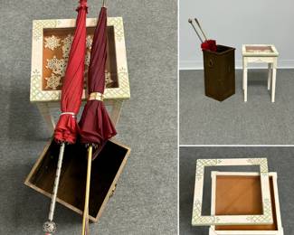 The French style parasols shown with a small hand-painted square table with shadow box lid, and a vintage square brass umbrella stand featuring a minimalist design with side ring handles