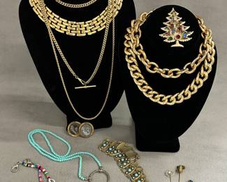 Costume jewelry necklaces, brooches, and even stick pins! Glam up with gold-tone chunky chain link necklaces, sparkle in the holidays with a Brooks gold tone multi-rhinestone Christmas tree brooch, and wear your whimsy with a colorful beaded necklace with carved white elephant station beads.